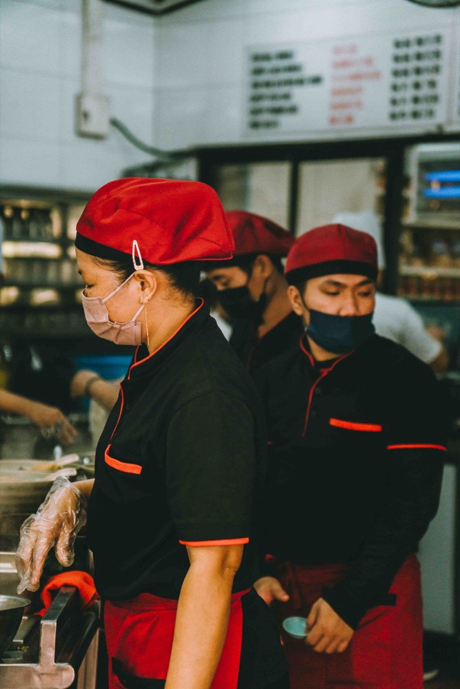 Chefs working together in a busy kitchen