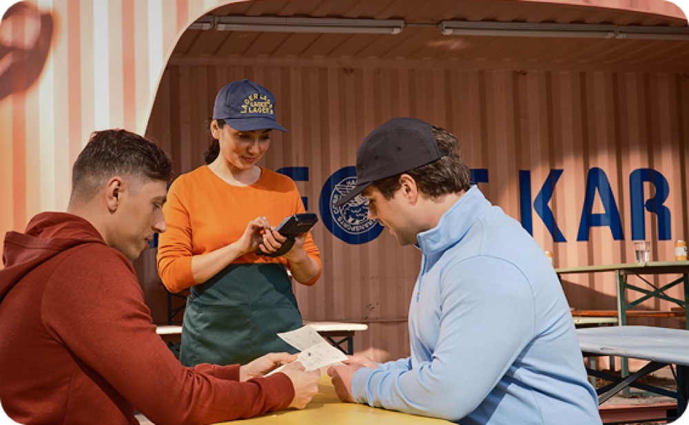 Guests ordering at a restaurant counter